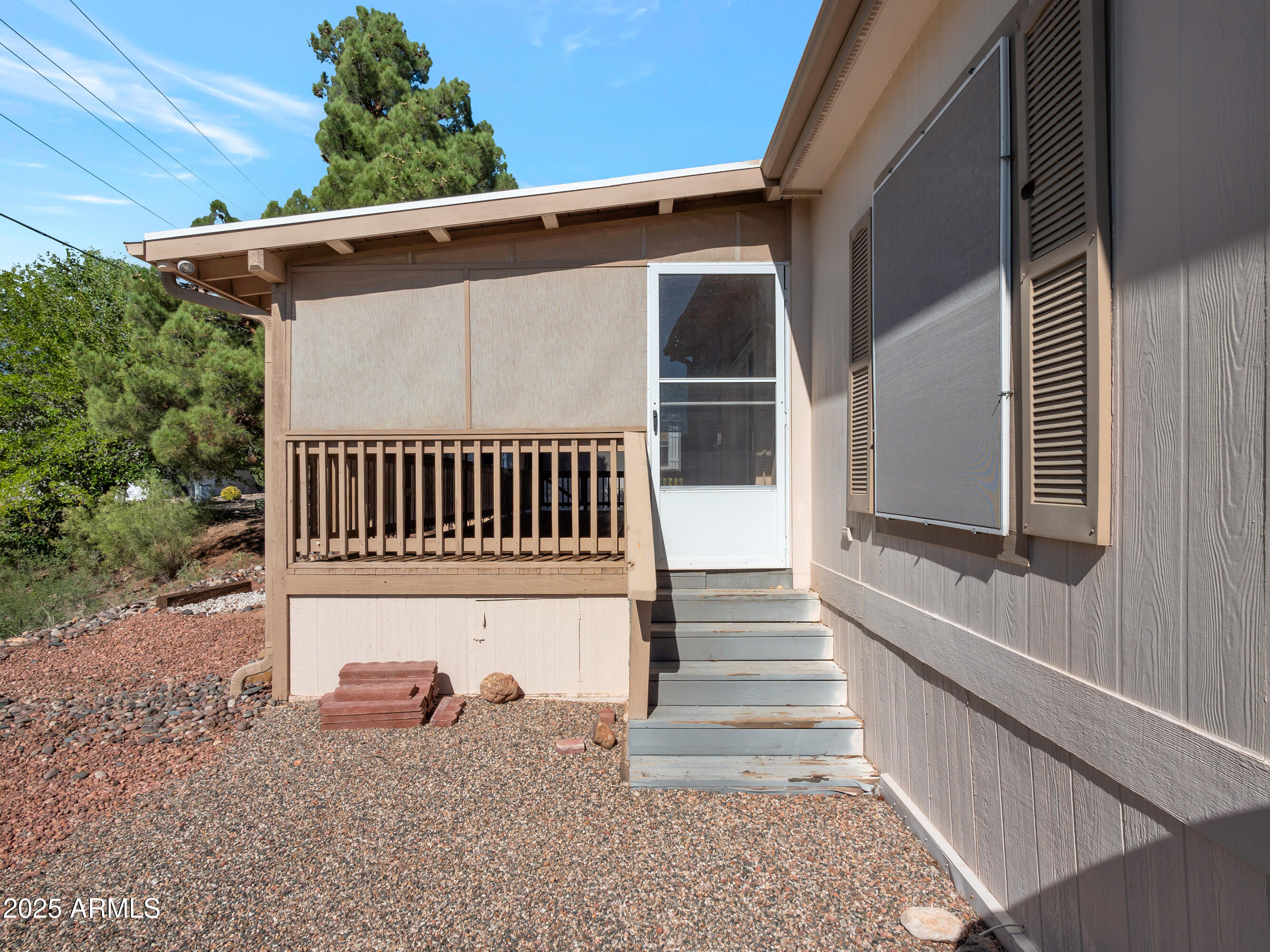 2050 West State Rte 89A, Unit 344 Sedona, AZ 86336 - Photo 33 of 35 a view of porch with wooden stairs and a bench