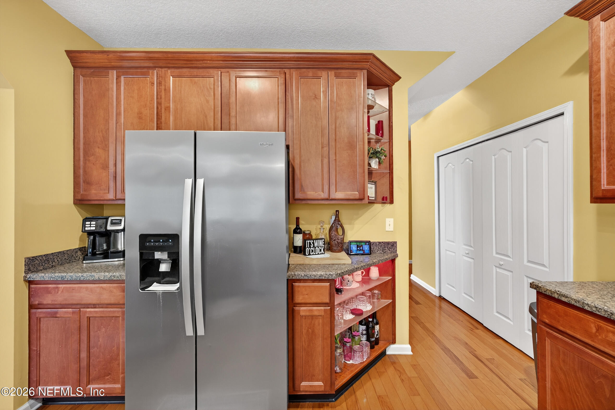 588 Reflection Cove Road Jacksonville, FL 32218 - Photo 18 of 53 a kitchen with stainless steel appliances granite countertop a refrigerator and a stove