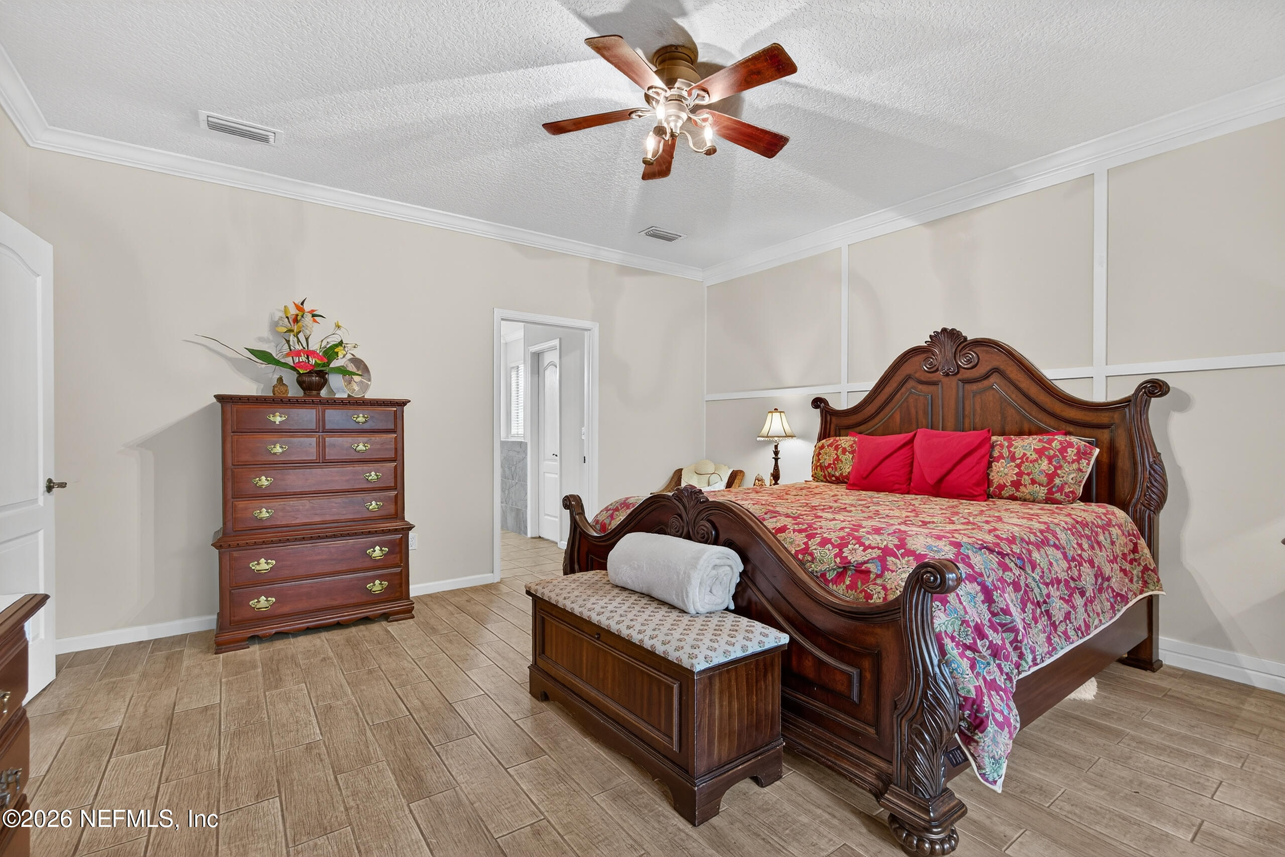 588 Reflection Cove Road Jacksonville, FL 32218 - Photo 20 of 53 a bedroom with a bed and a dresser