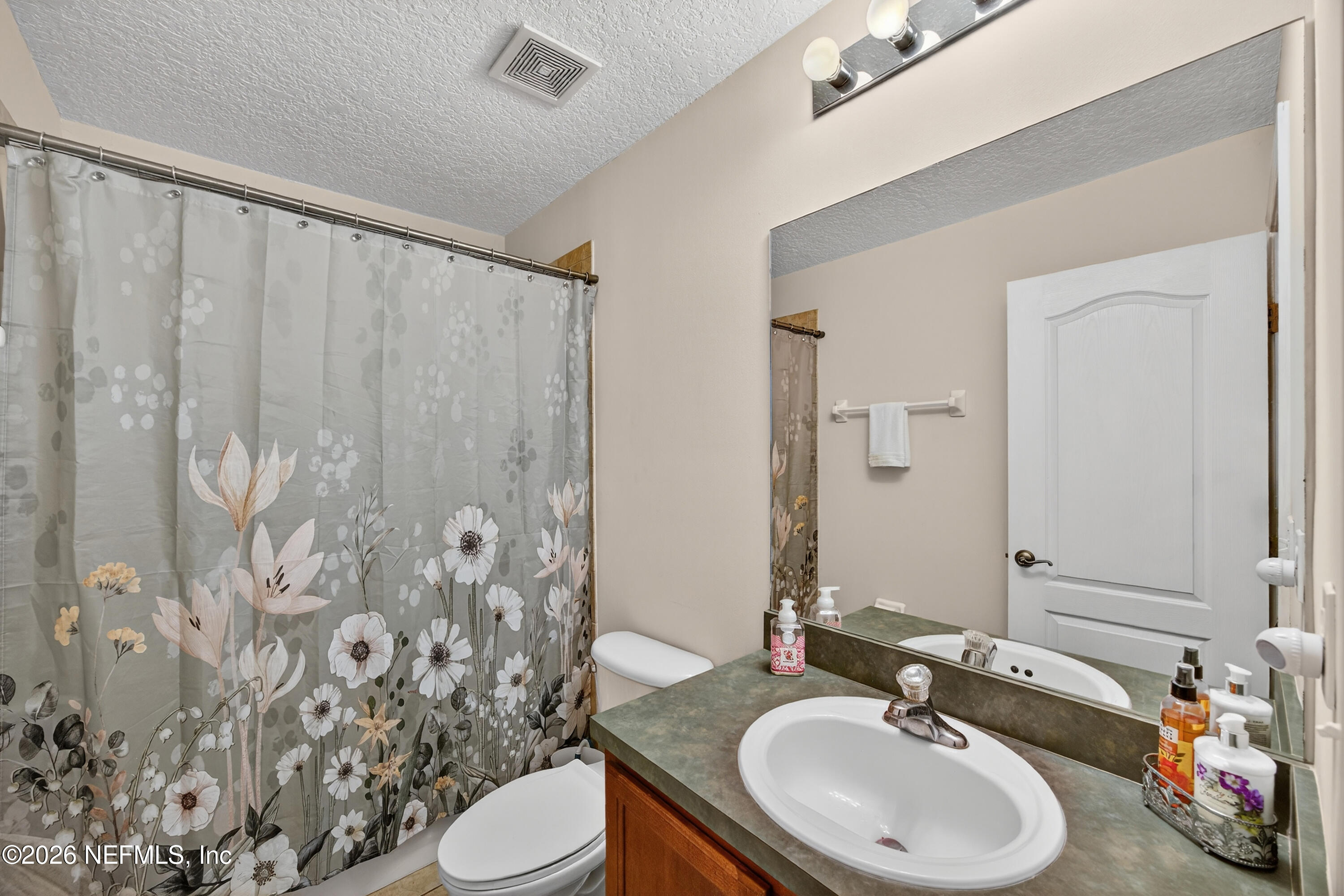 588 Reflection Cove Road Jacksonville, FL 32218 - Photo 29 of 53 a bathroom with a sink and a mirror