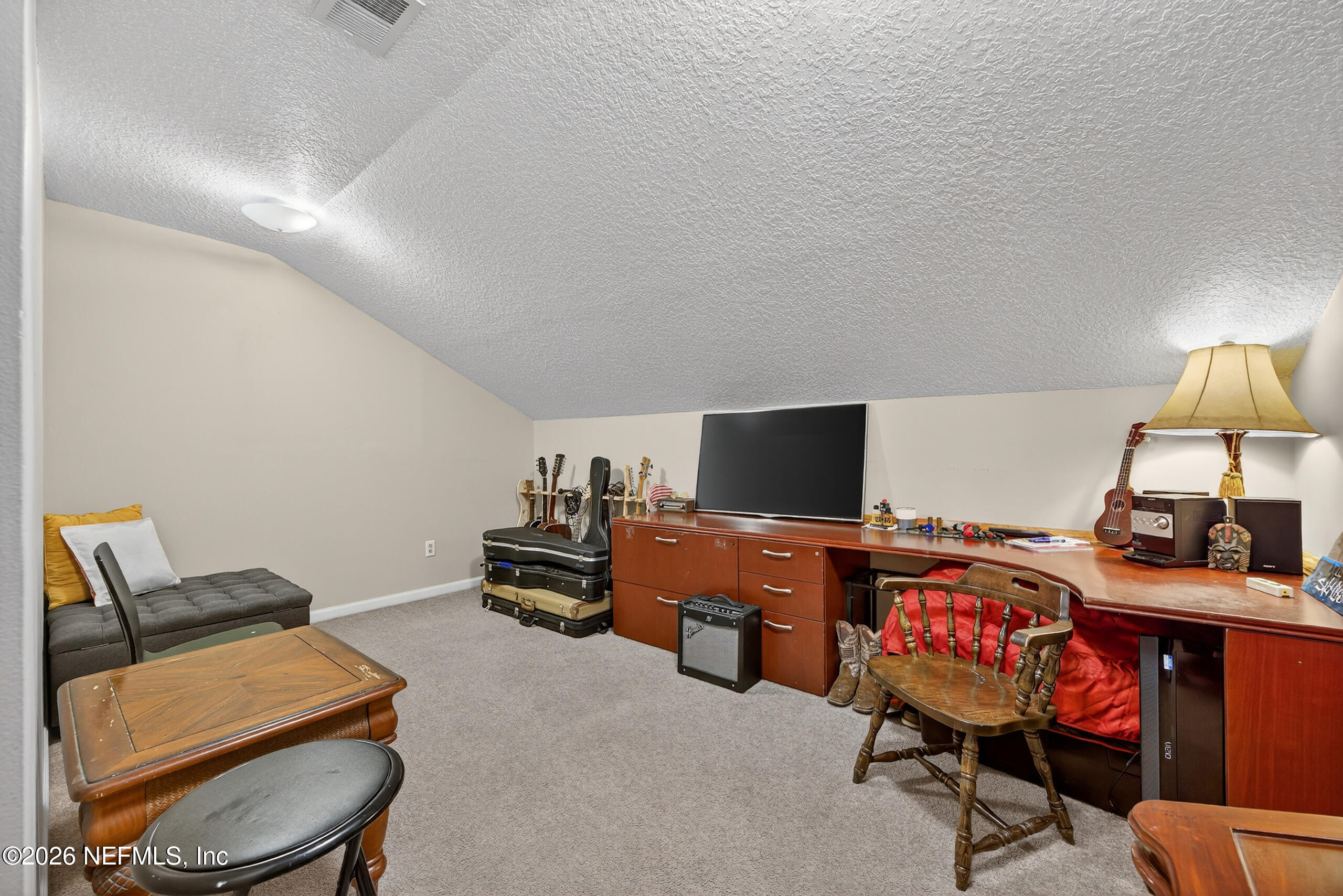 588 Reflection Cove Road Jacksonville, FL 32218 - Photo 36 of 53 a room with furniture and a flat screen tv