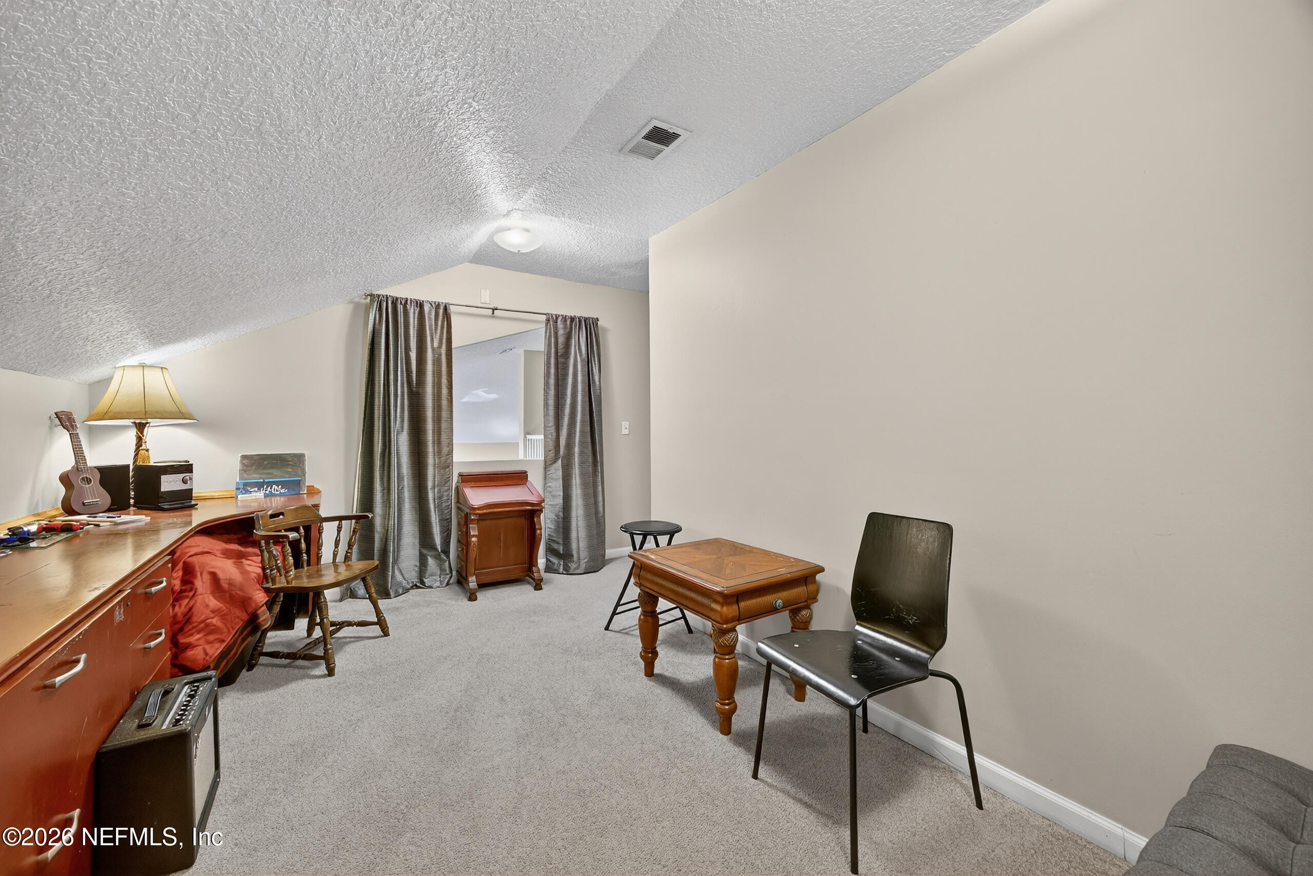 588 Reflection Cove Road Jacksonville, FL 32218 - Photo 37 of 53 a room with two chair and a gym equipment