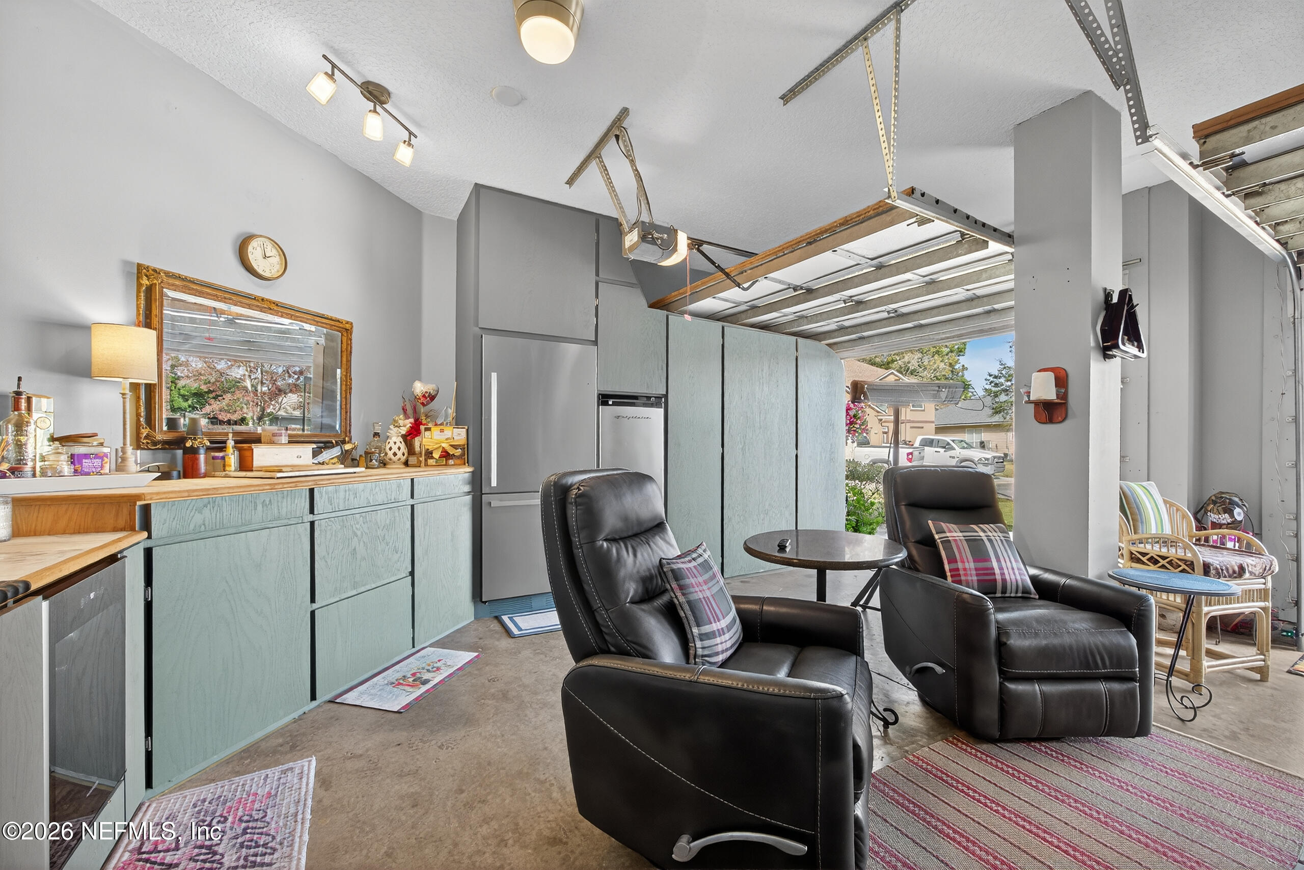 588 Reflection Cove Road Jacksonville, FL 32218 - Photo 42 of 53 a living room with furniture and a flat screen tv