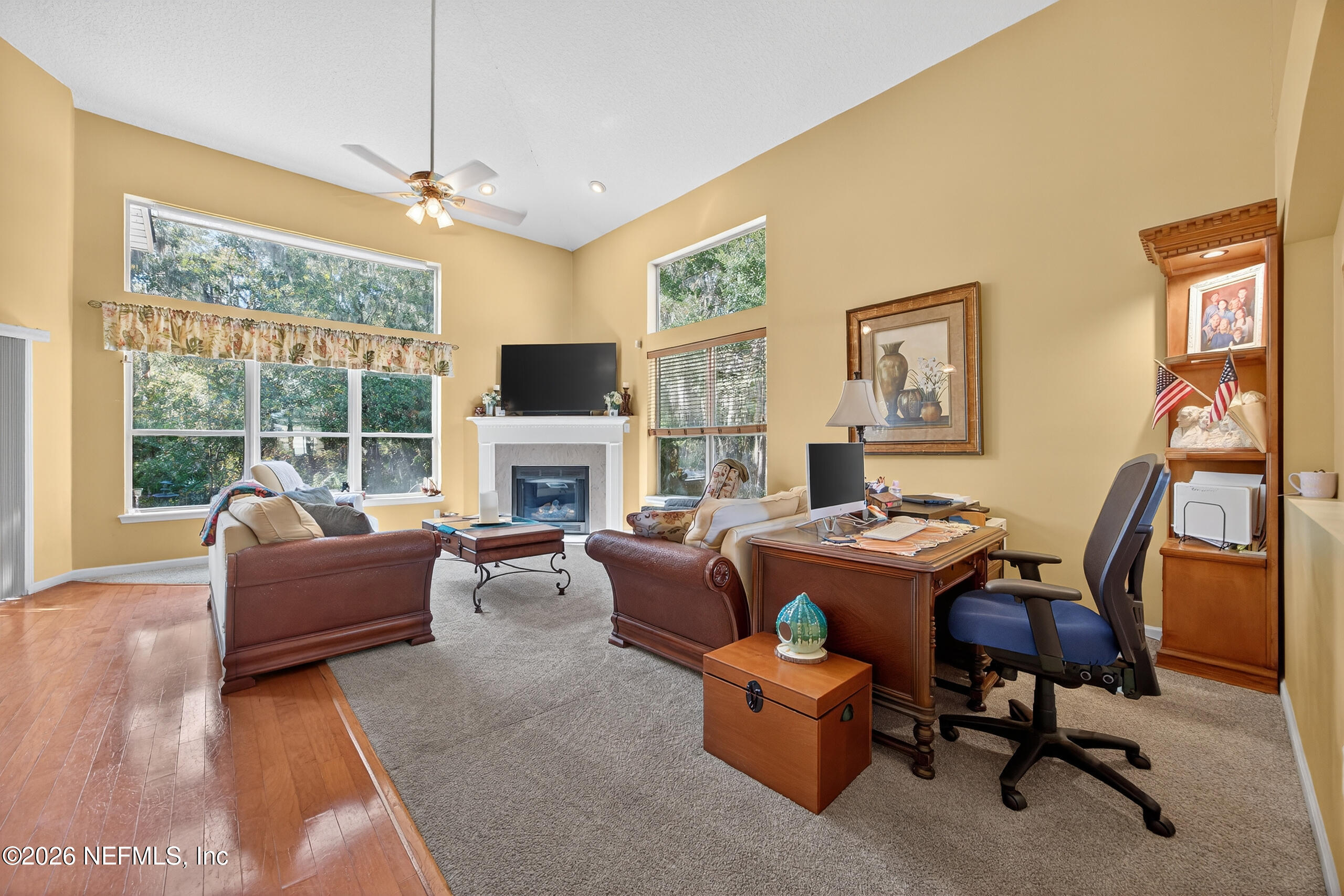 588 Reflection Cove Road Jacksonville, FL 32218 - Photo 8 of 53 a living room with furniture fireplace and a large window