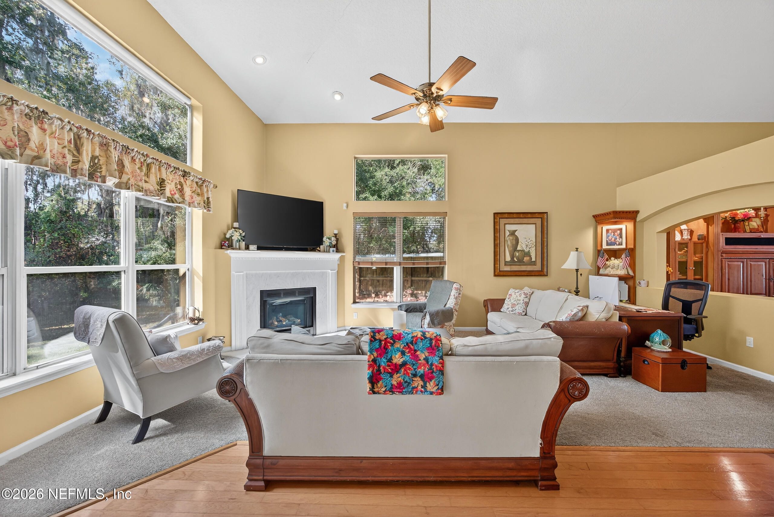 588 Reflection Cove Road Jacksonville, FL 32218 - Photo 9 of 53 a living room with furniture and a fireplace