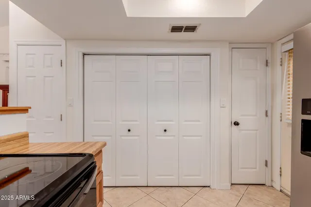 a room that has a bed and a dresser in it