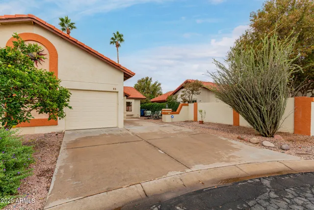 a view of a house with a yard and garage