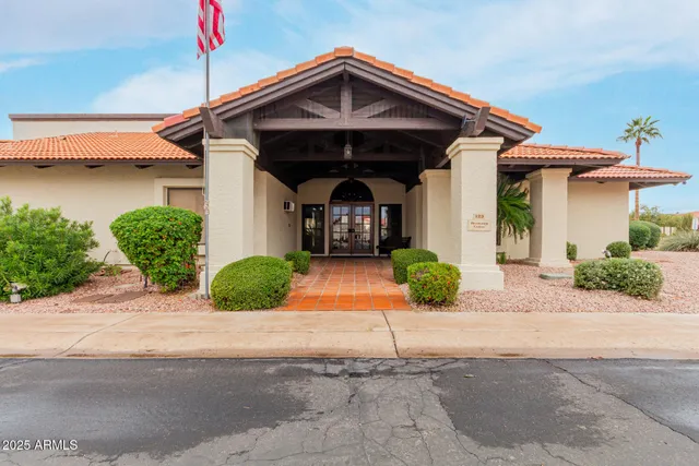 a view of an house with swimming pool and sitting area