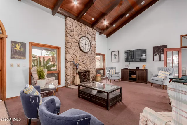 a room with pool table and windows