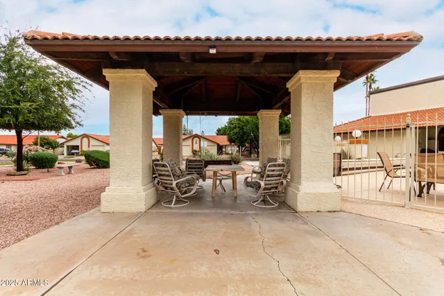 a view of a backyard with potted plants