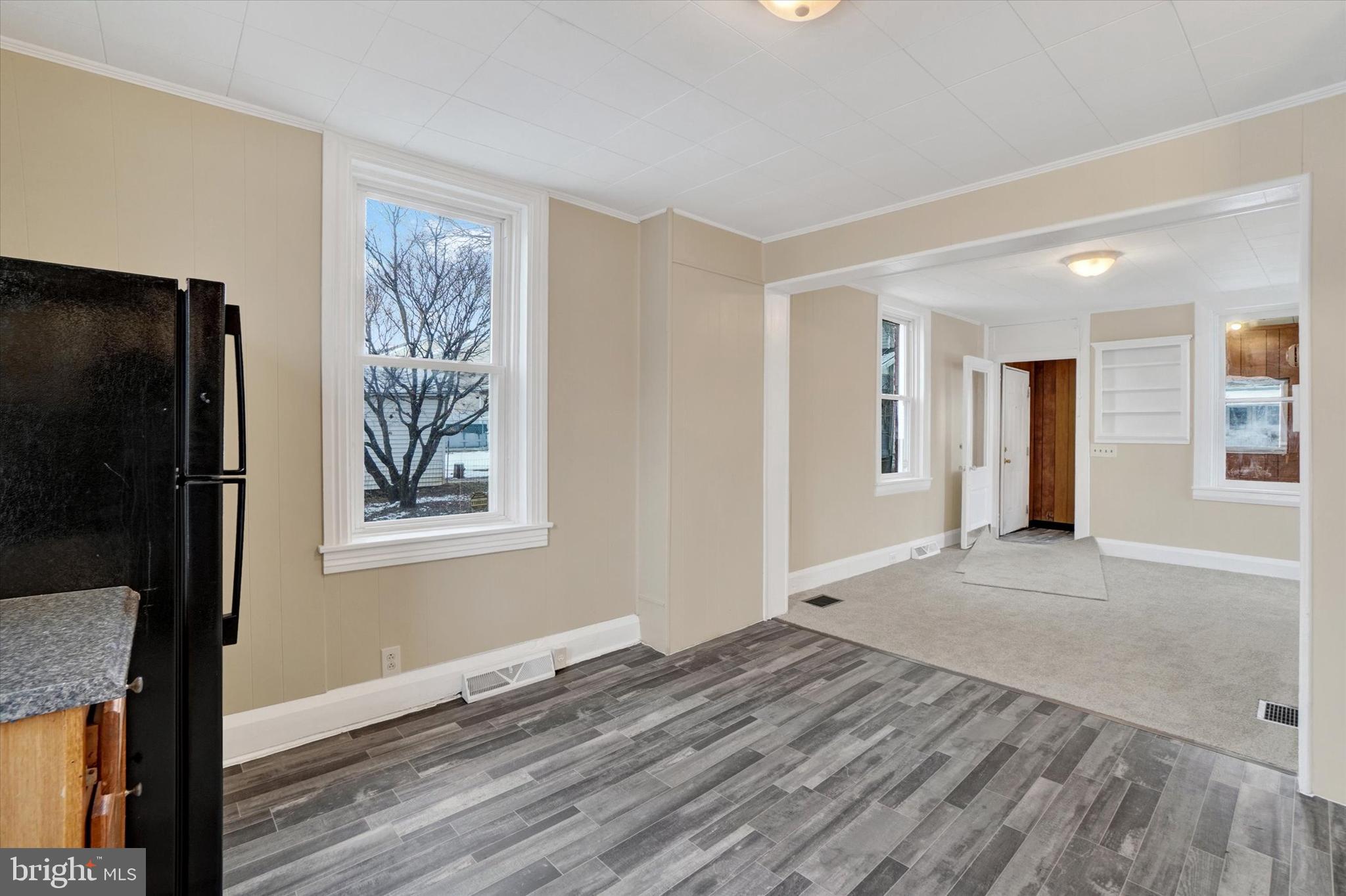 923 East Princess Street York, PA 17403 - Photo 12 of 24 a view of an empty room with wooden floor and a window
