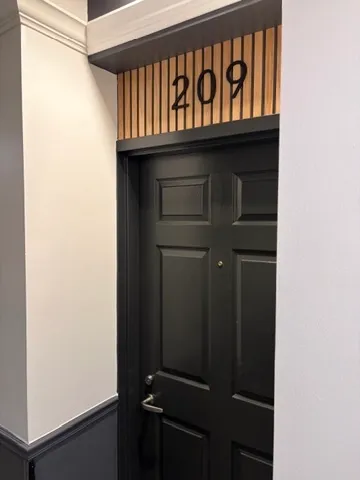 a kitchen with wooden cabinets and a stove top oven