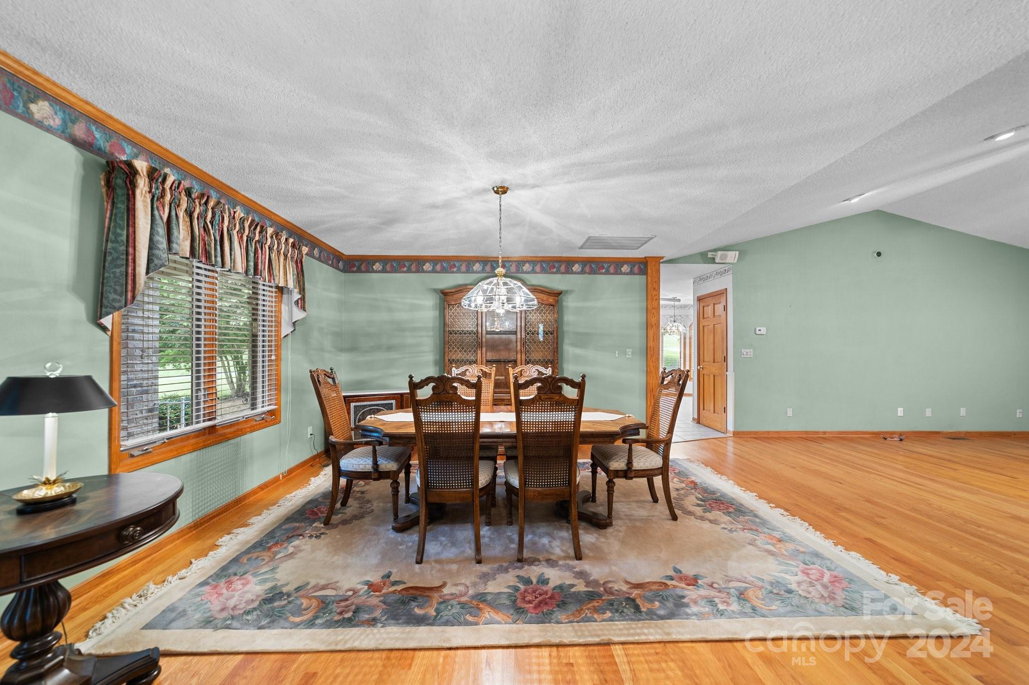 1808 Thompson Drive Concord, NC 28025 - Photo 15 of 48 a view of a dining room with furniture window and wooden floor
