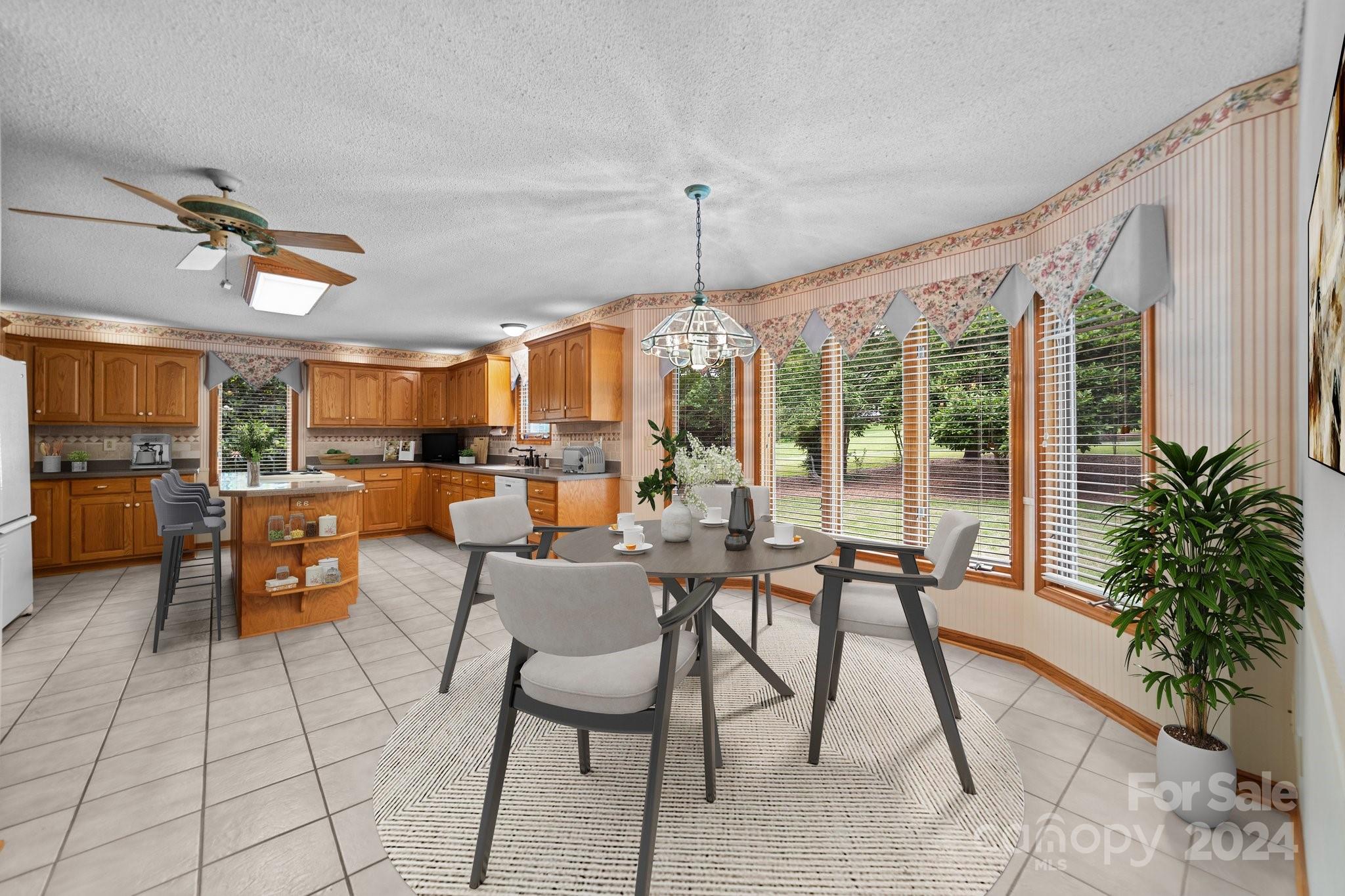 1808 Thompson Drive Concord, NC 28025 - Photo 16 of 48 a living room with lots of furniture and a potted plant
