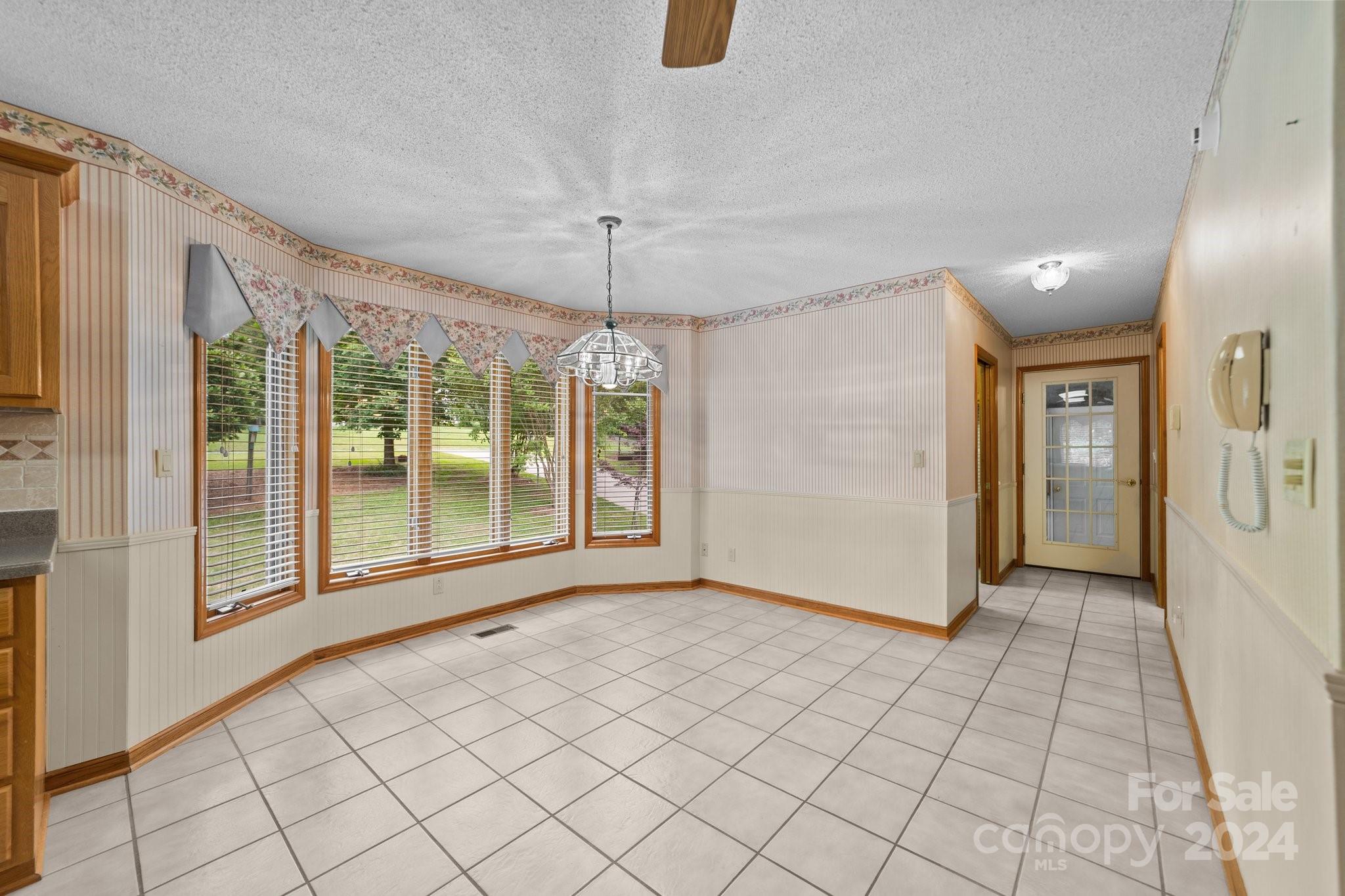 1808 Thompson Drive Concord, NC 28025 - Photo 18 of 48 a view of empty room with wooden floor and fan