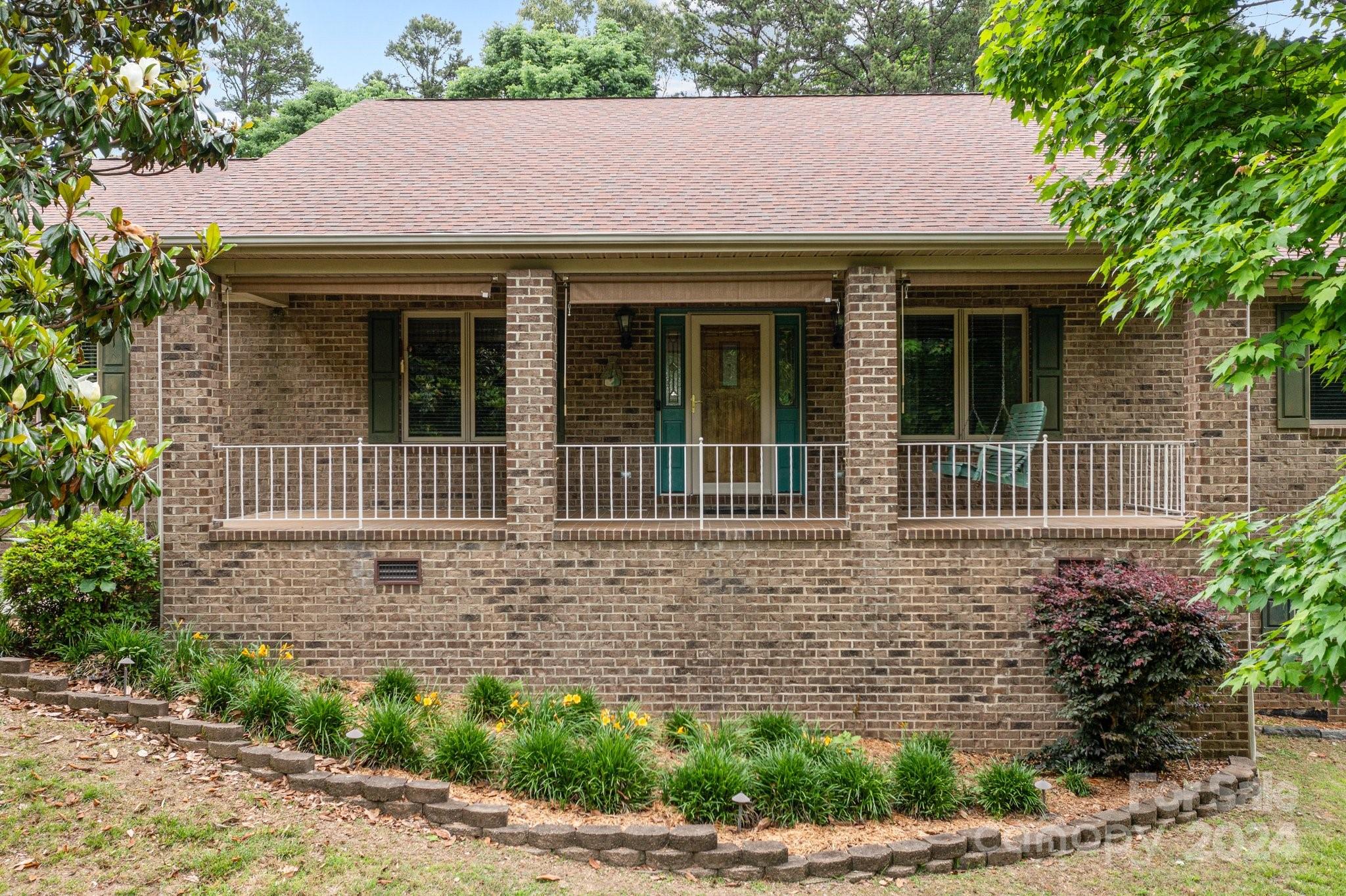 1808 Thompson Drive Concord, NC 28025 - Photo 2 of 48 a view of a house with a small window and a small yard