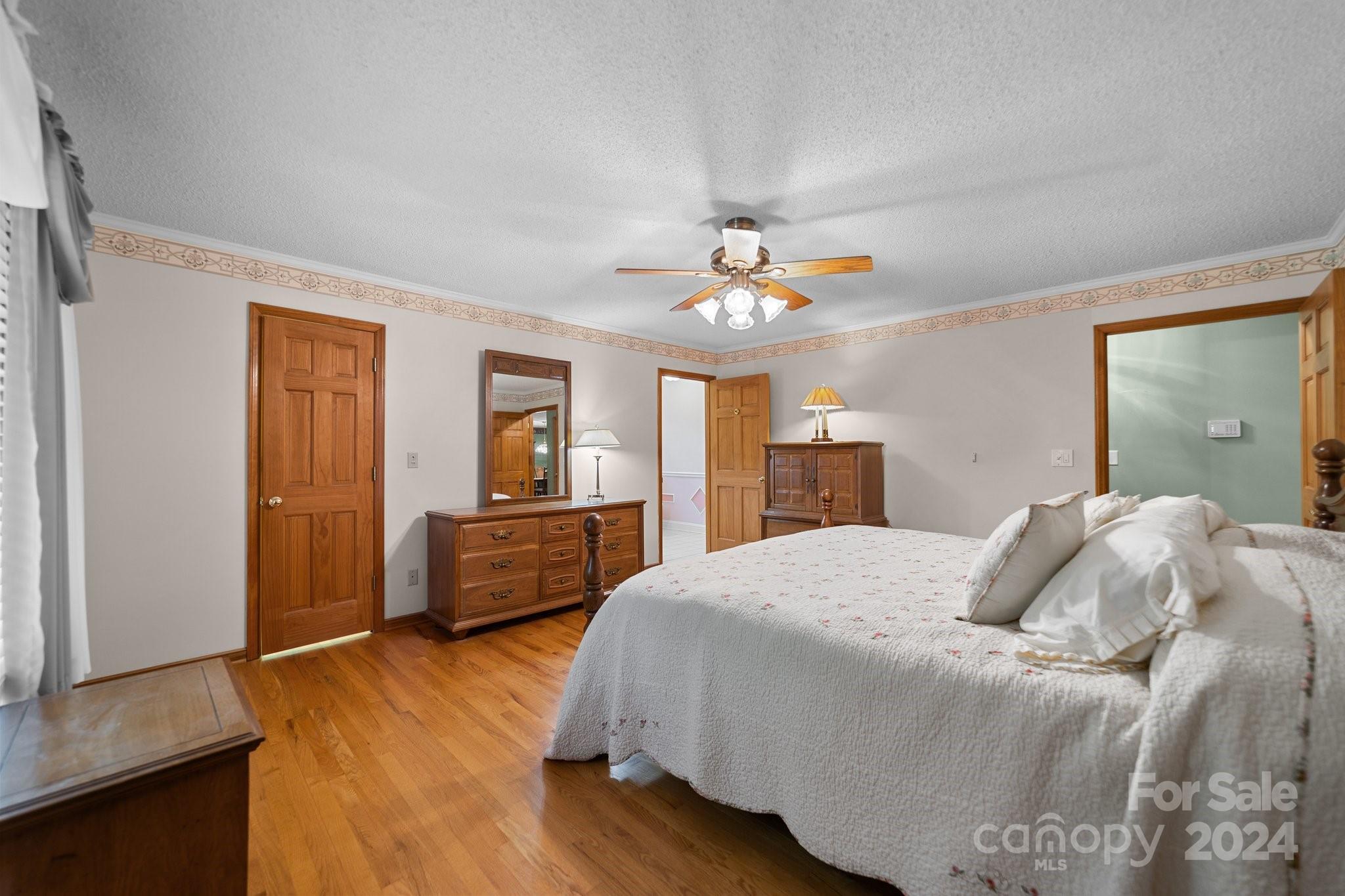 1808 Thompson Drive Concord, NC 28025 - Photo 24 of 48 a bedroom with a bed and a chandelier