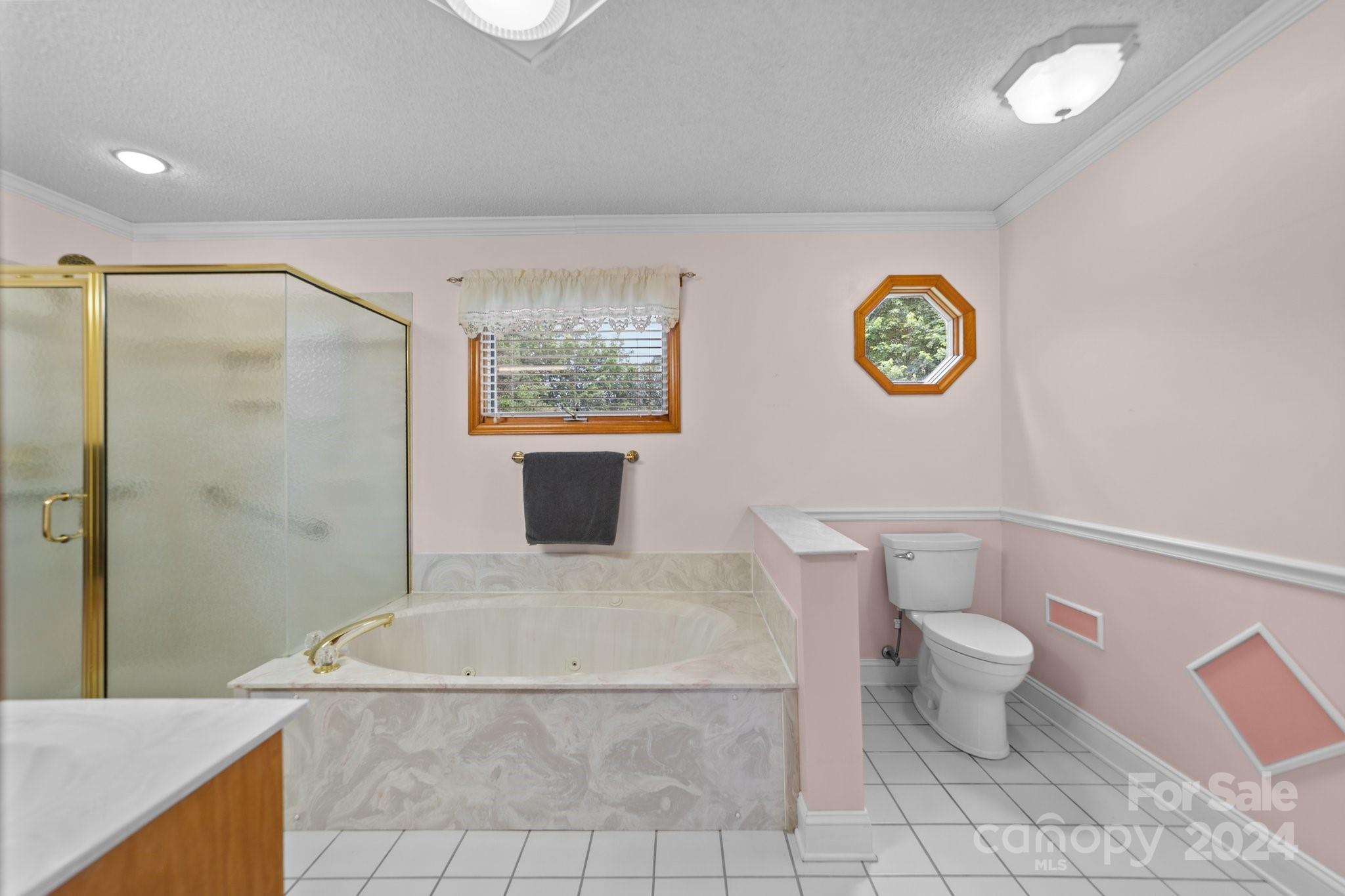 1808 Thompson Drive Concord, NC 28025 - Photo 26 of 48 a spacious bathroom with a granite countertop sink a toilet and a shower