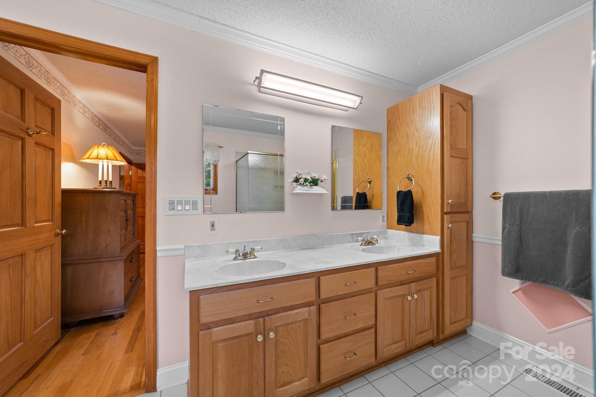 1808 Thompson Drive Concord, NC 28025 - Photo 27 of 48 a spacious bathroom with a double vanity sink a mirror and a shower