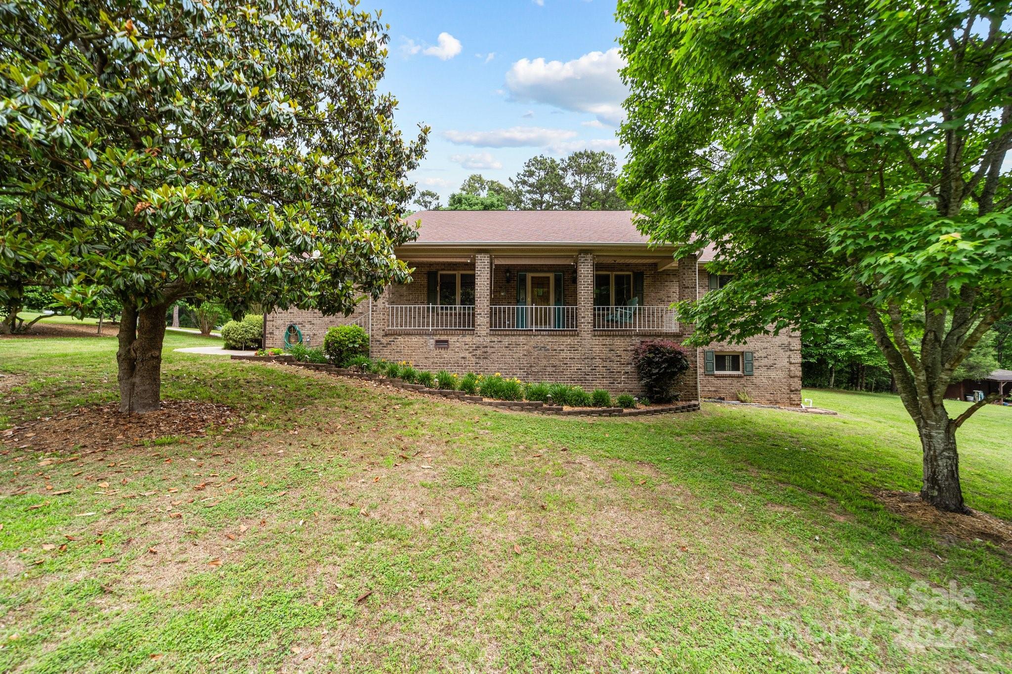 1808 Thompson Drive Concord, NC 28025 - Photo 3 of 48 a front view of a house with a yard
