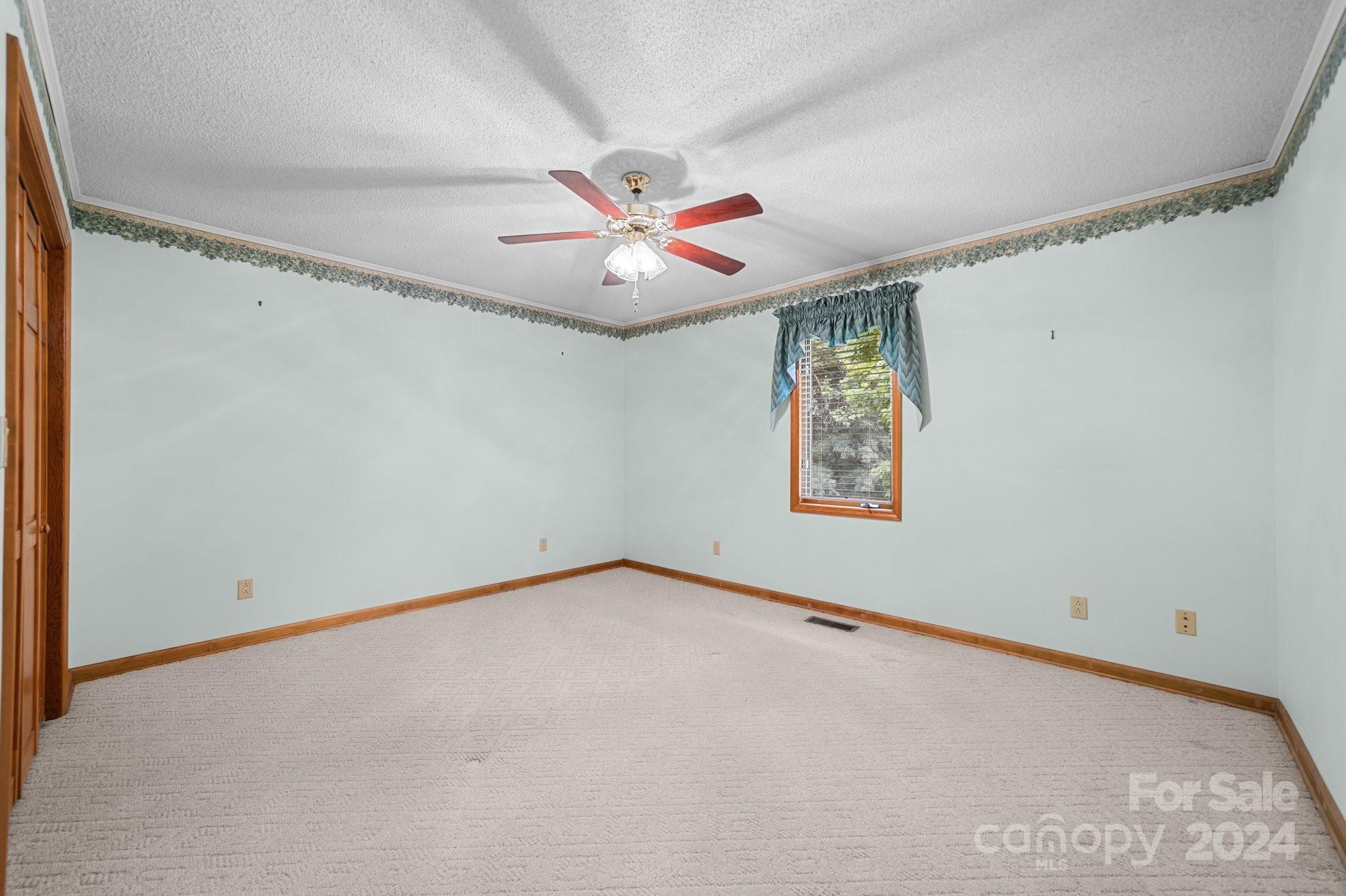 1808 Thompson Drive Concord, NC 28025 - Photo 31 of 48 an empty room with windows and fan