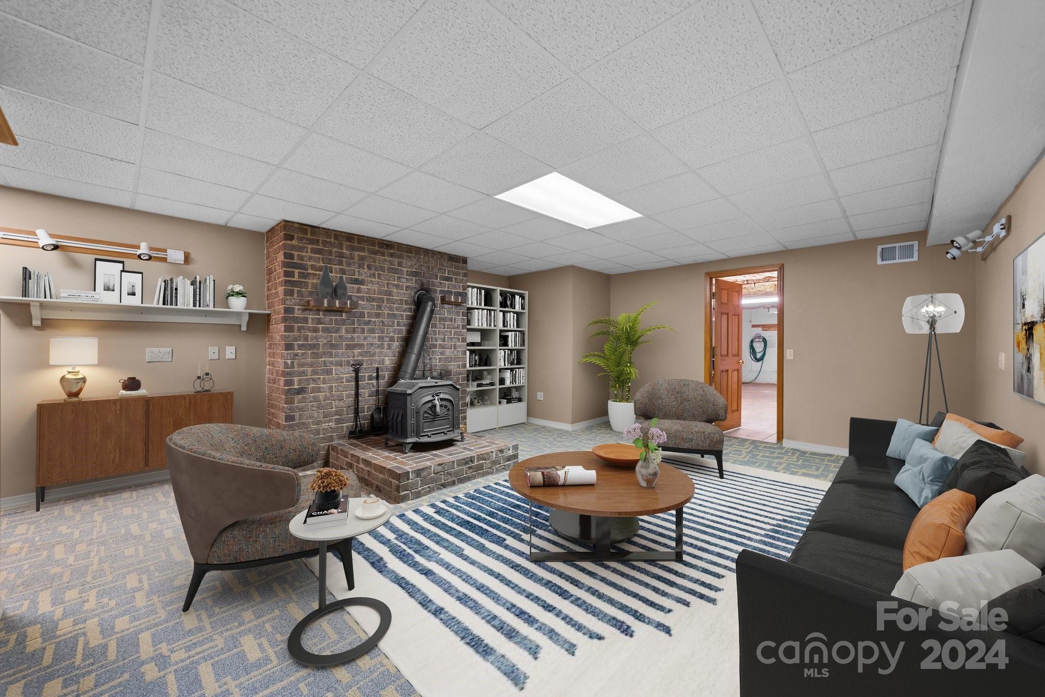 1808 Thompson Drive Concord, NC 28025 - Photo 33 of 48 a living room with furniture a rug and a table