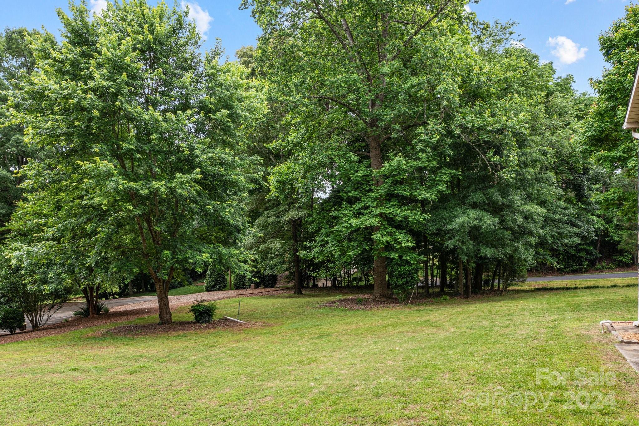 1808 Thompson Drive Concord, NC 28025 - Photo 43 of 48 a view of a swimming pool with a bench
