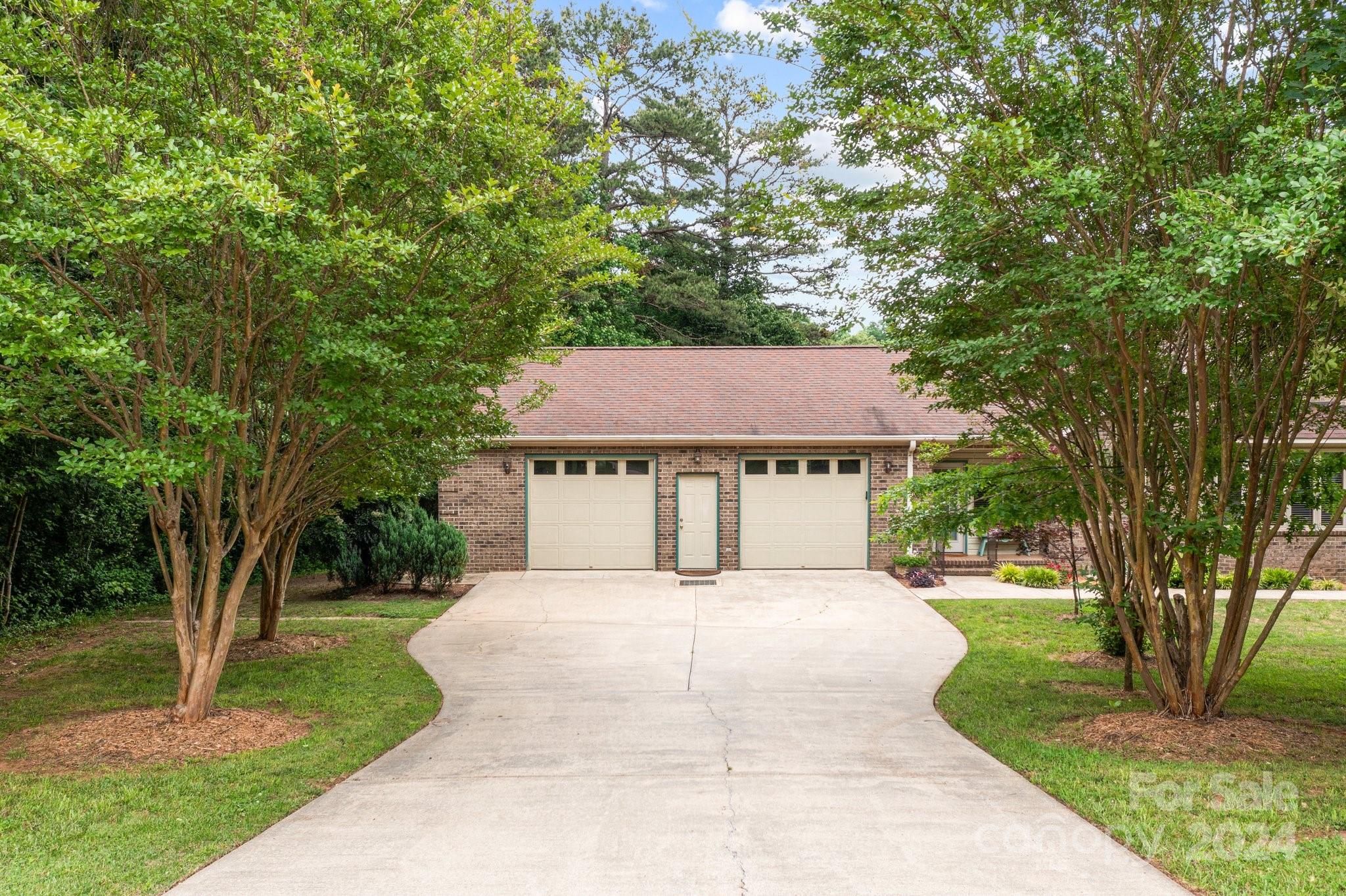 1808 Thompson Drive Concord, NC 28025 - Photo 6 of 48 a house with trees in front of it