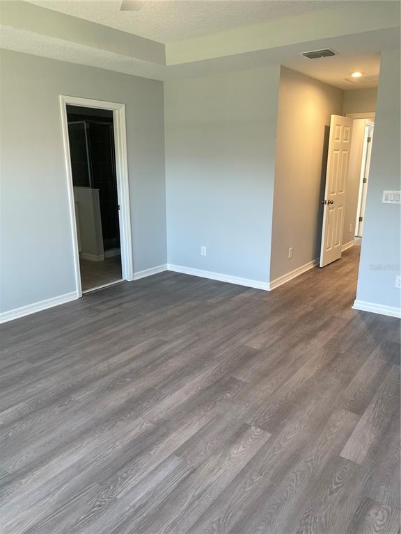 8937 Matriarca Alley Windermere, FL 34786 - Photo 11 of 17 a view of an empty room with wooden floor