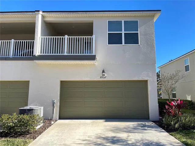 a view of a house with a bench