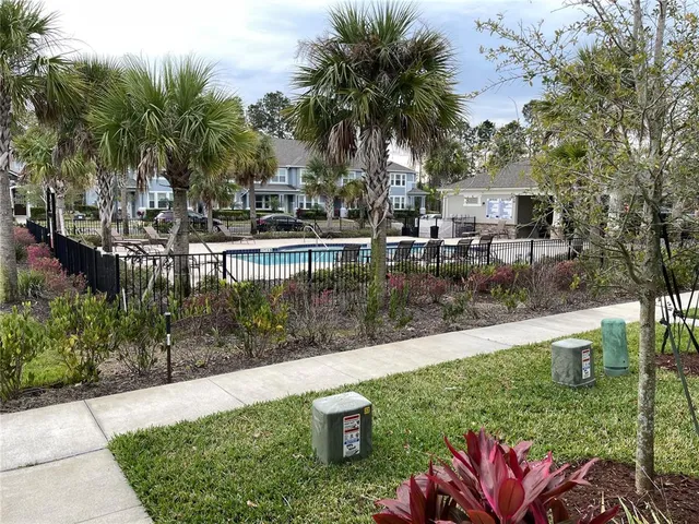 a view of a garden with sitting area