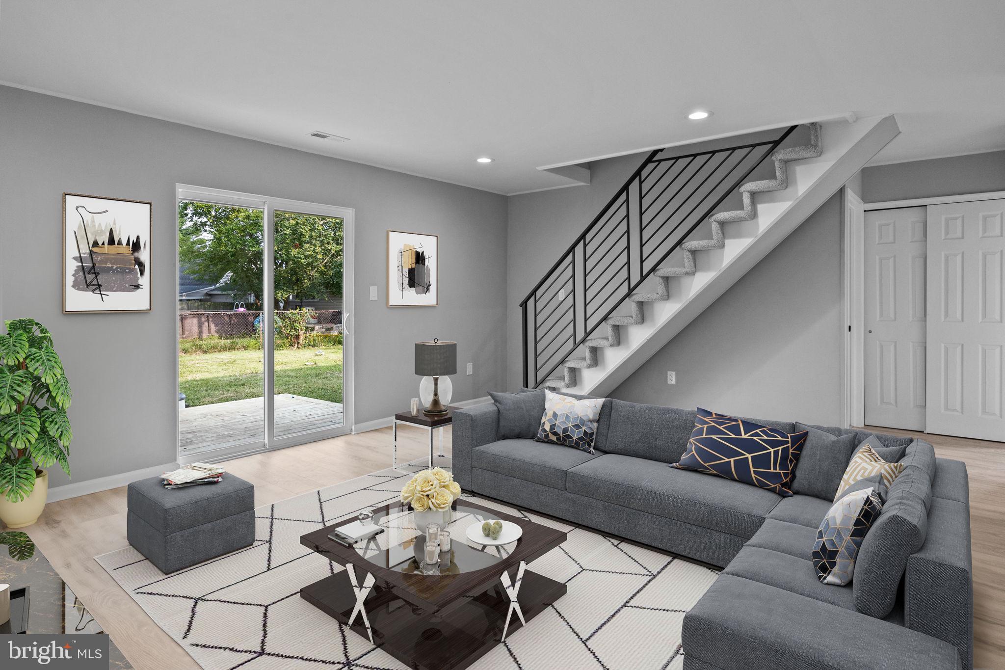 28 Gooseneck Road Levittown, PA 19057 - Photo 1 of 23 a living room with furniture and a large window
