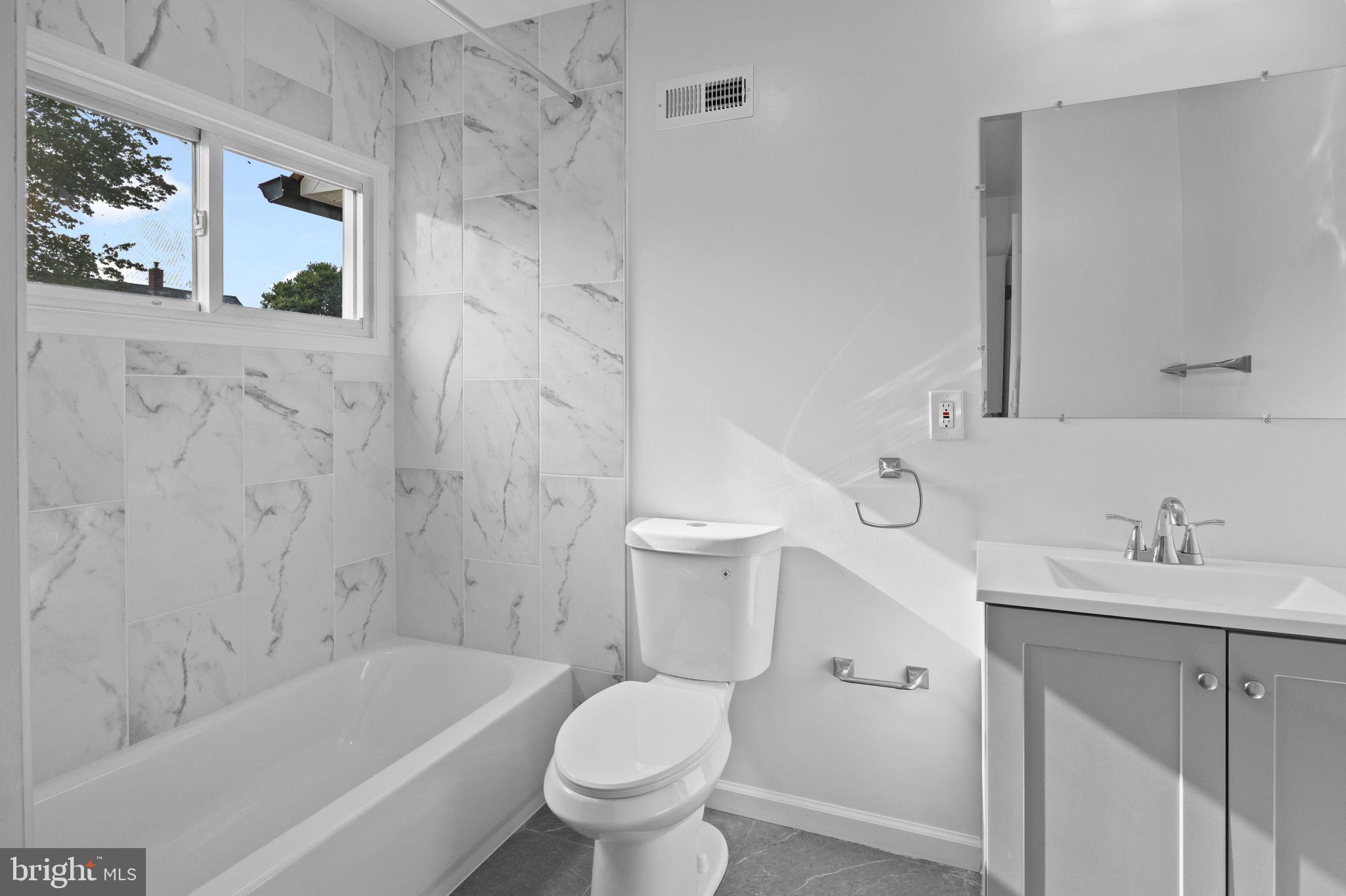 28 Gooseneck Road Levittown, PA 19057 - Photo 11 of 23 a bathroom with a sink toilet and bathtub