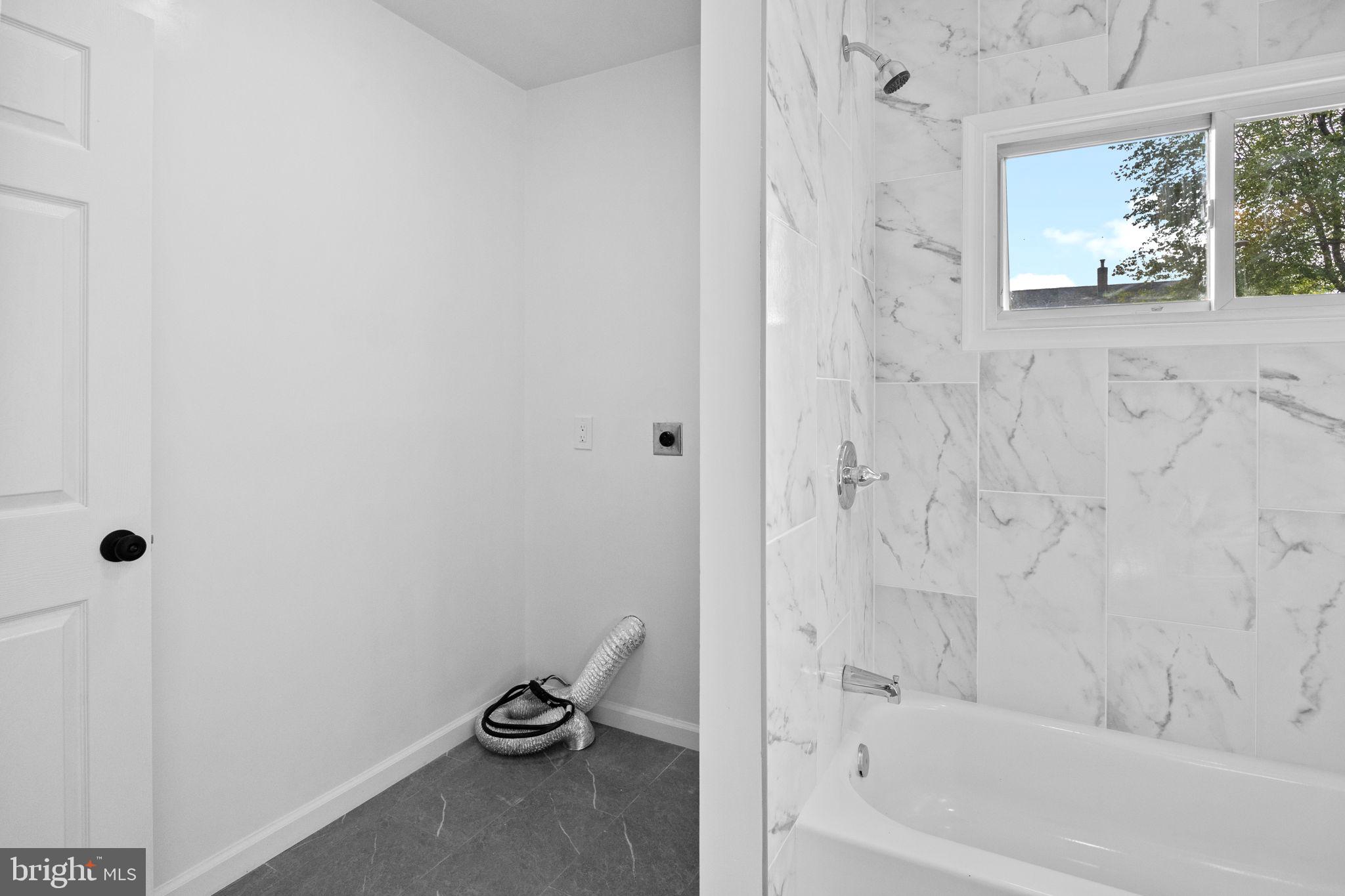 28 Gooseneck Road Levittown, PA 19057 - Photo 12 of 23 a bathroom with a granite countertop window