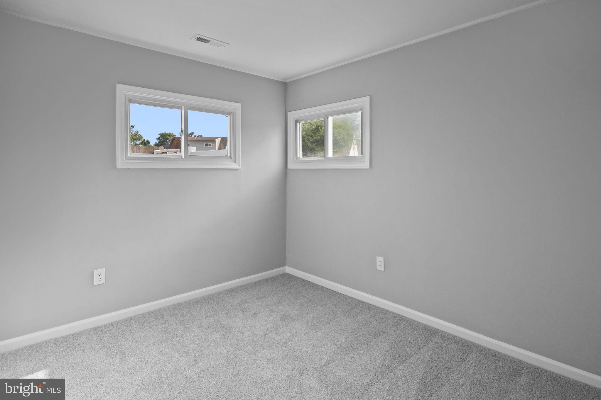 28 Gooseneck Road Levittown, PA 19057 - Photo 13 of 23 a view of an empty room with a window