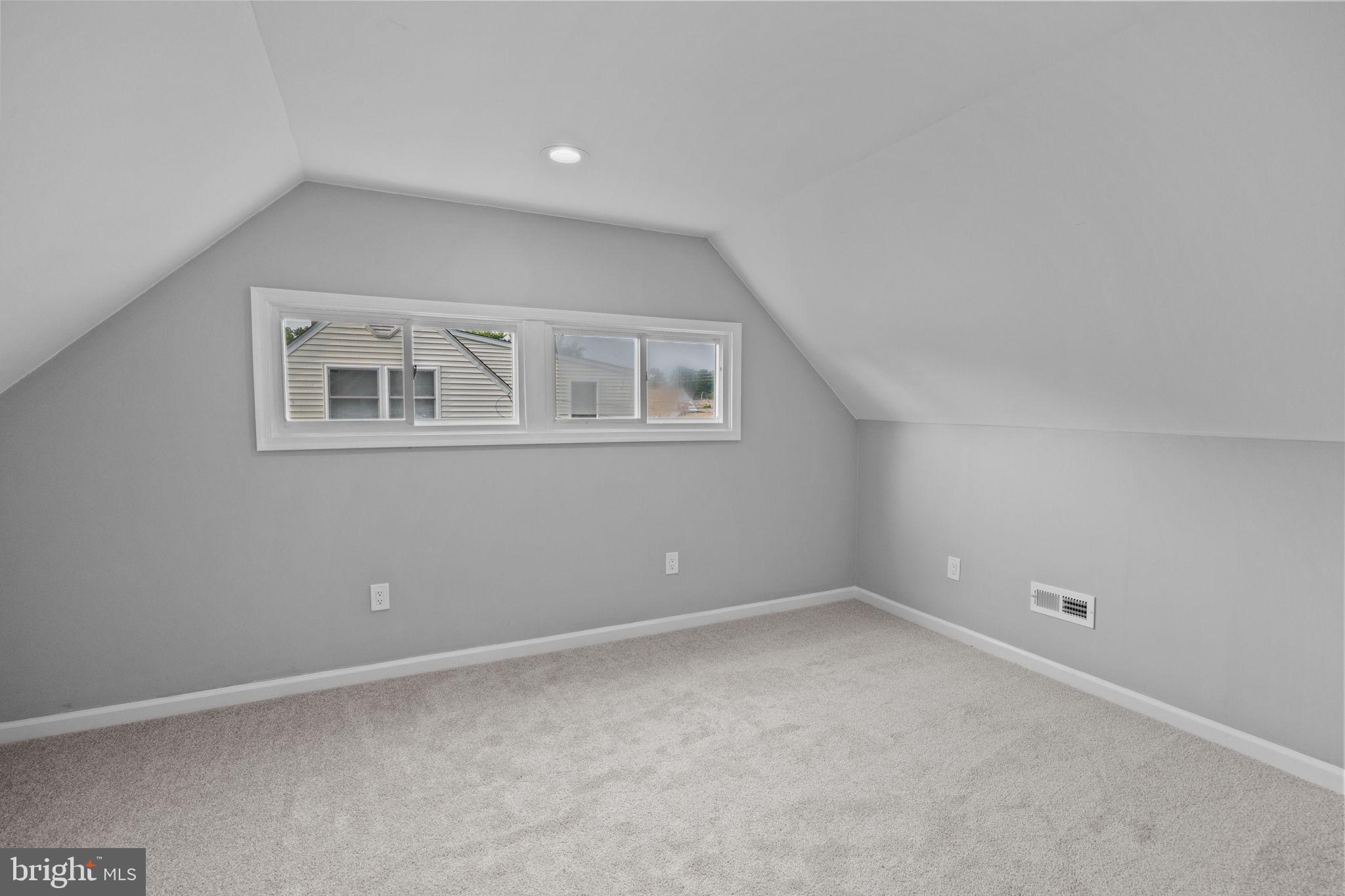 28 Gooseneck Road Levittown, PA 19057 - Photo 18 of 23 a view of an empty room with a window