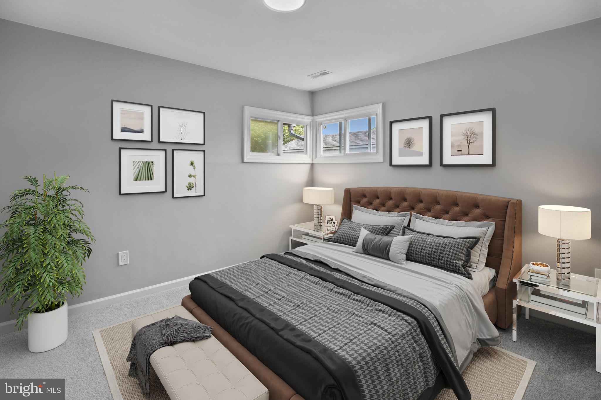 28 Gooseneck Road Levittown, PA 19057 - Photo 2 of 23 a bedroom with bed and a potted plant