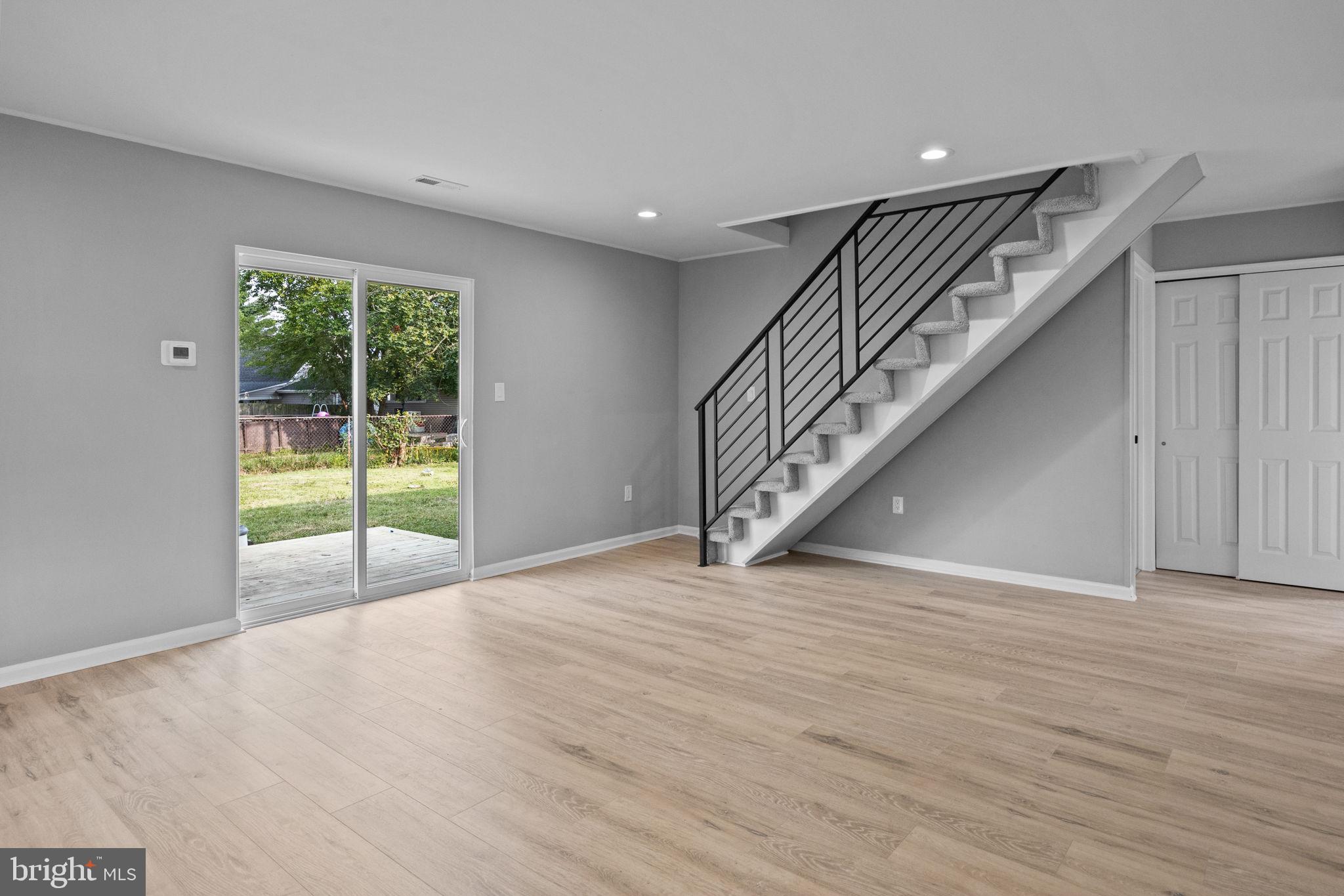 28 Gooseneck Road Levittown, PA 19057 - Photo 6 of 23 an empty room with wooden floor and windows