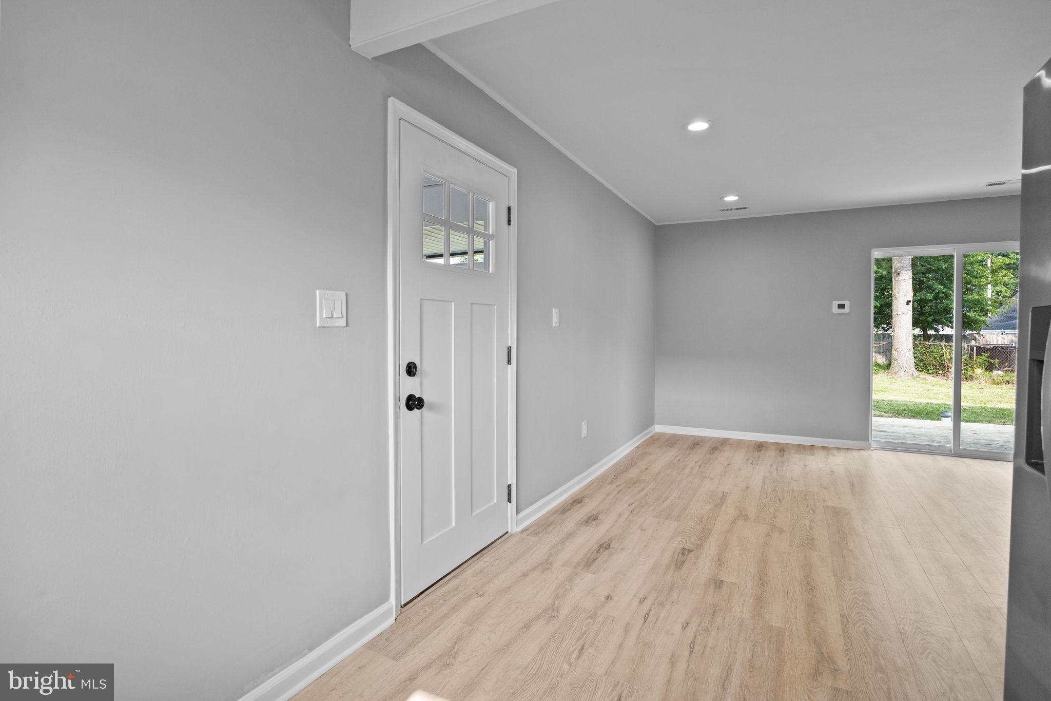 28 Gooseneck Road Levittown, PA 19057 - Photo 9 of 23 wooden floor in an empty room with a window