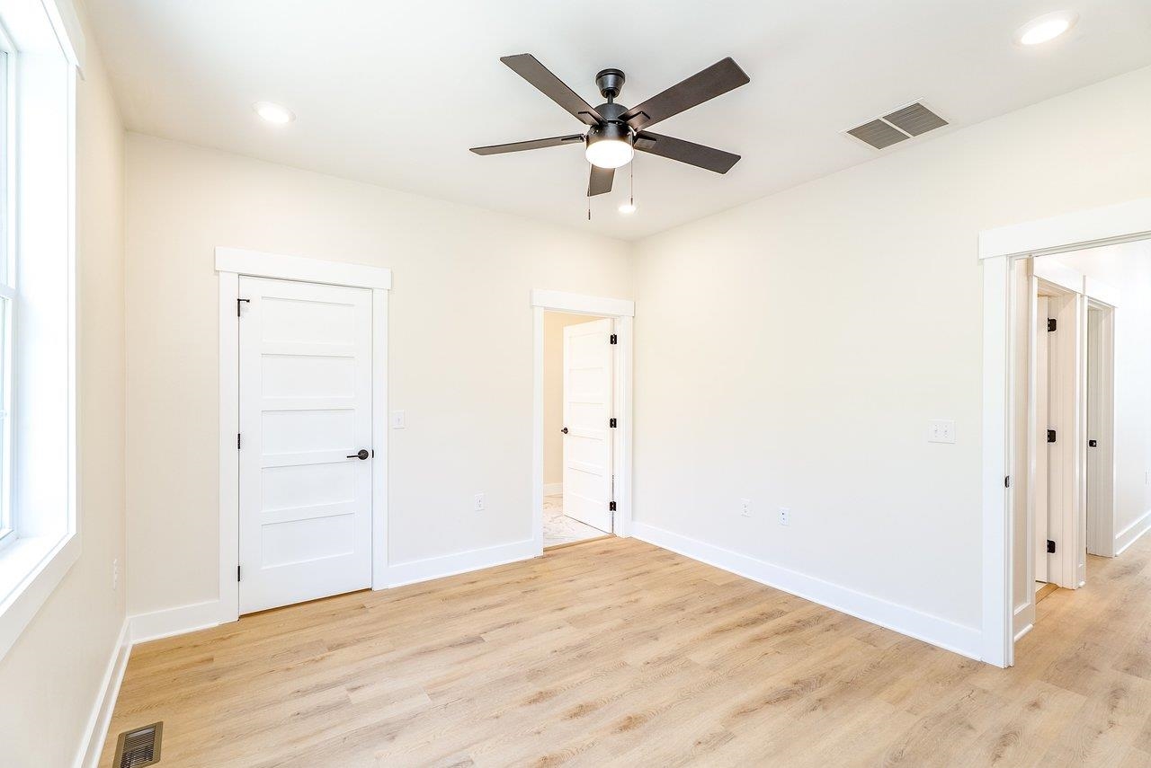 1378 Melrose Road Harrisonburg, VA 22802 - Photo 31 of 75 a view of a livingroom with a ceiling fan and wooden floor