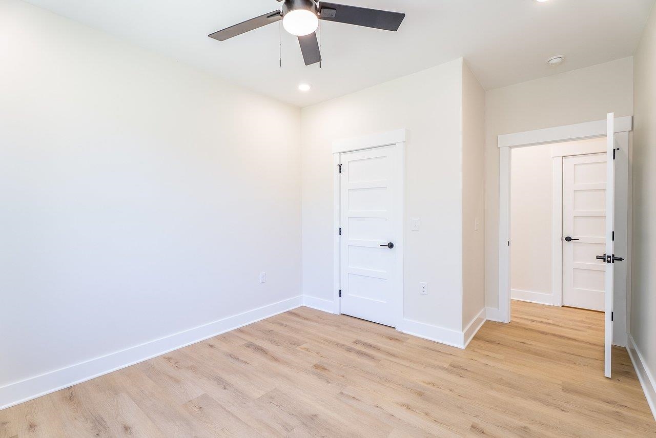 1378 Melrose Road Harrisonburg, VA 22802 - Photo 38 of 75 an empty room with a ceiling fan and wooden floor