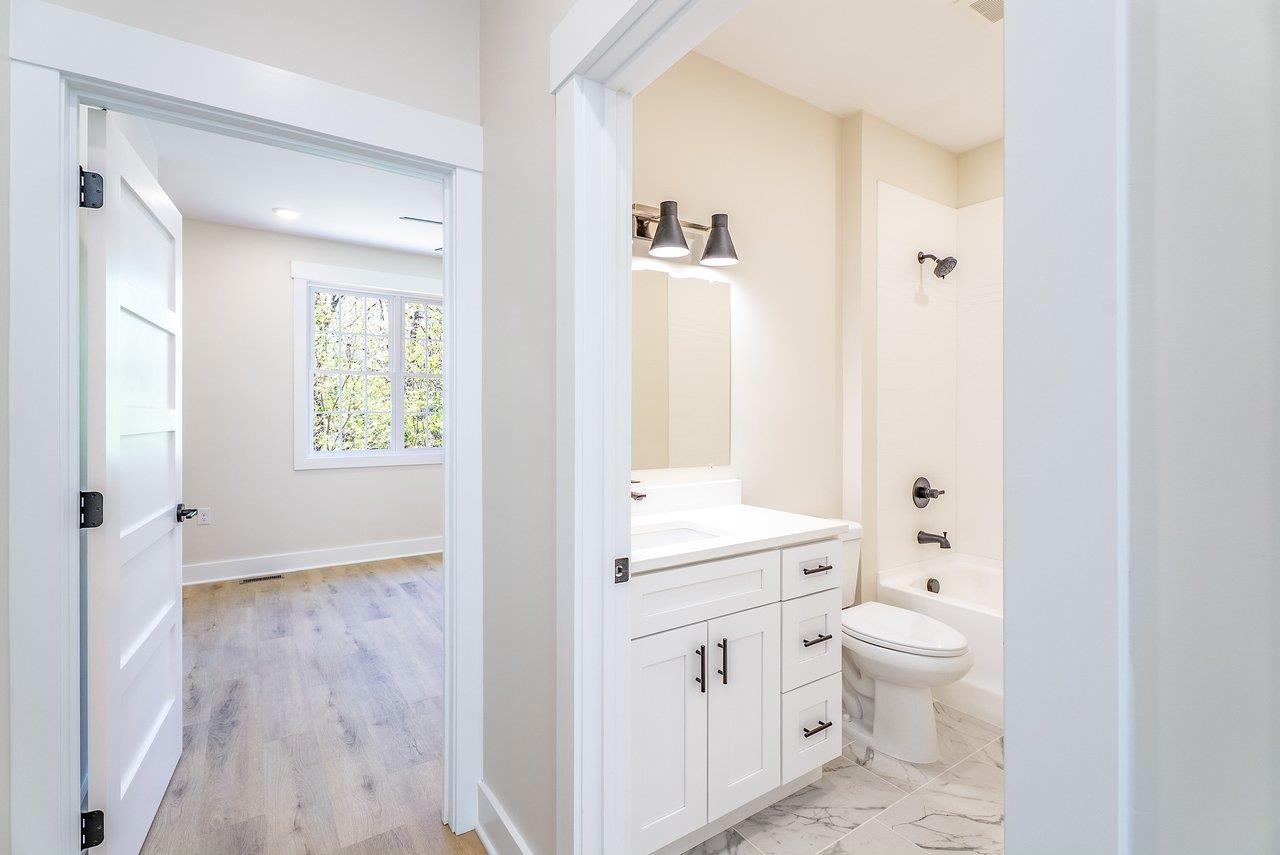 1378 Melrose Road Harrisonburg, VA 22802 - Photo 39 of 75 a bathroom with a toilet a sink and a mirror
