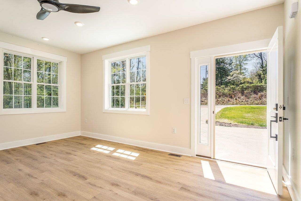 1378 Melrose Road Harrisonburg, VA 22802 - Photo 10 of 75 a view of an empty room with a window and wooden floor