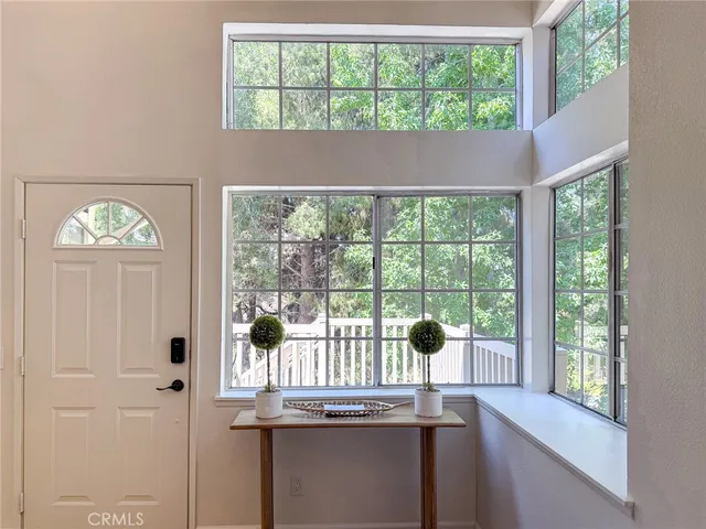a view of a dining room with furniture window and outside view