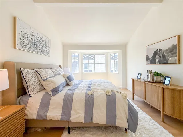 a en suite bathroom with a double vanity sink and a mirror