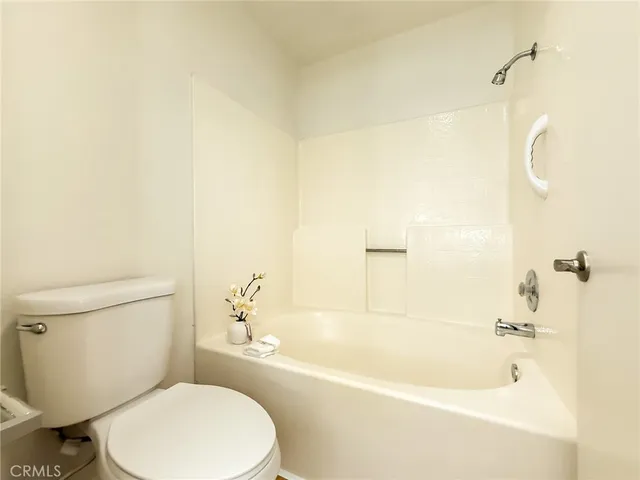 a view of a swimming pool with an outdoor seating