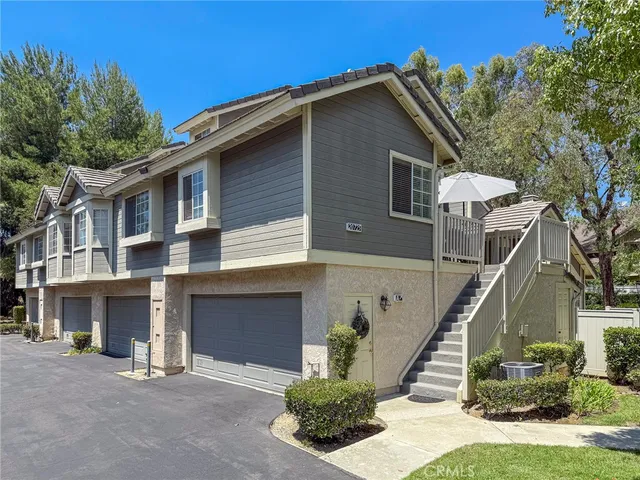 a view of outdoor space with garden and trees