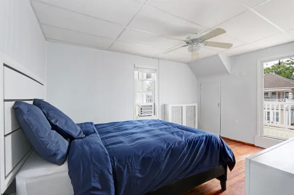 a bedroom with a bed and window