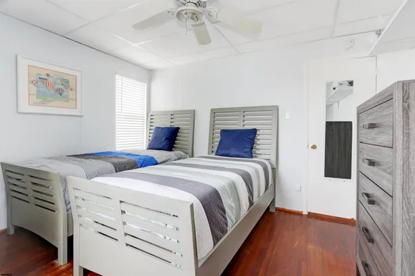 a bedroom with bed and a chandelier