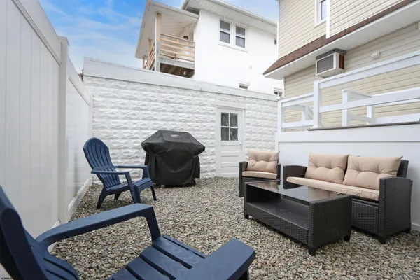 a living room with furniture and a rug